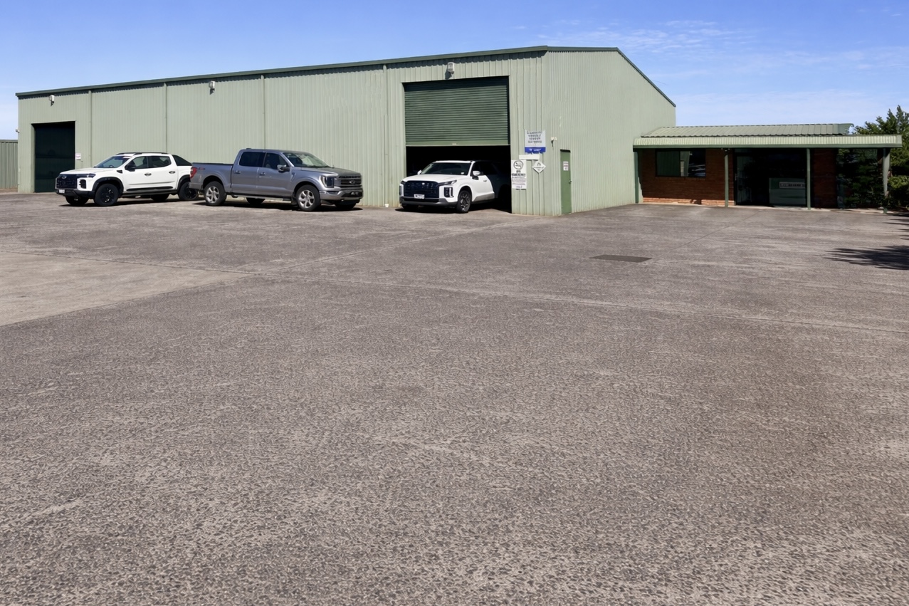 Workshop exterior with customer vehicles
